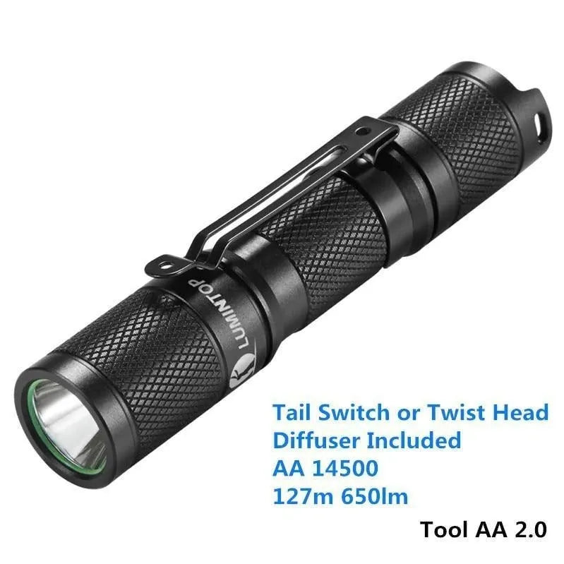 Lumintop Tool AA 2.0 black aluminium torch with keychain, shown next to included 14500 battery and diffuser.
