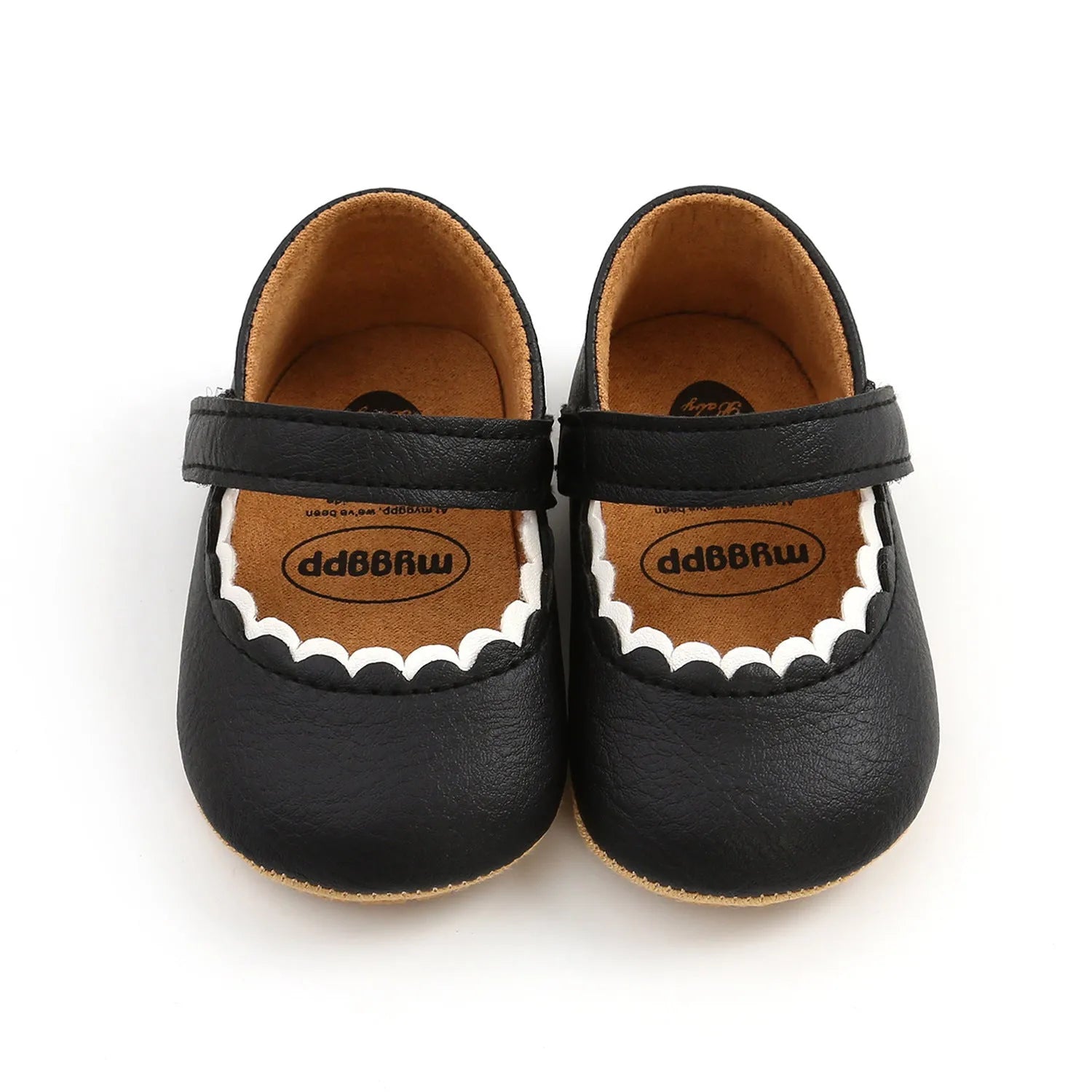 Baby girl's white velcro fastening shoes with low tube height, shown on a size chart.
