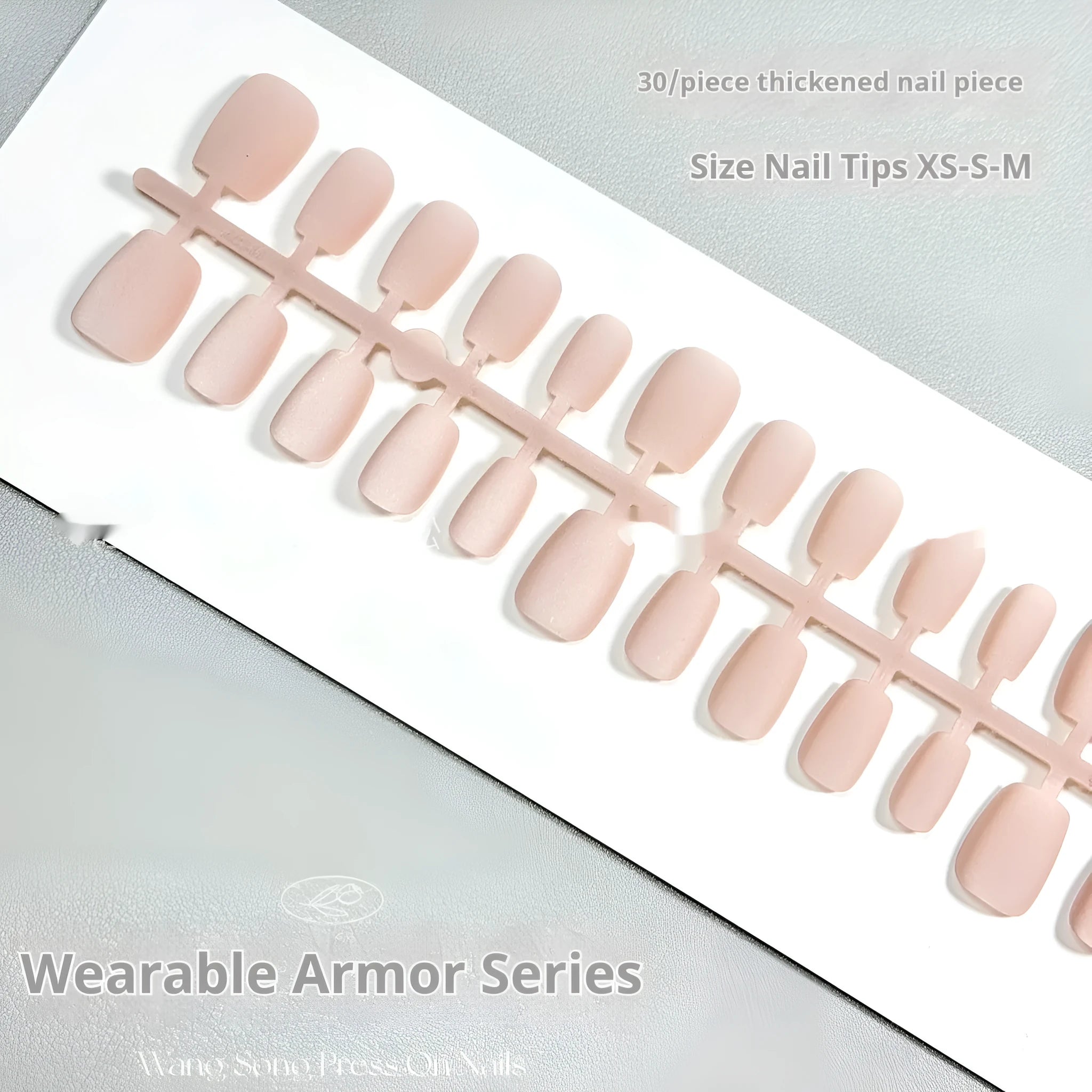 Set of frosted velvet Cat's Eye false nails in short ladder sizes XS, S, and M on a display stand.