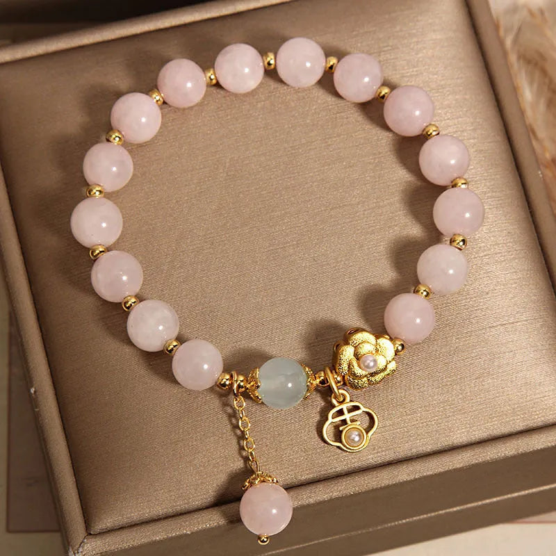 Women's pink crystal flower bracelet showing floral arrangement of stones on wrist