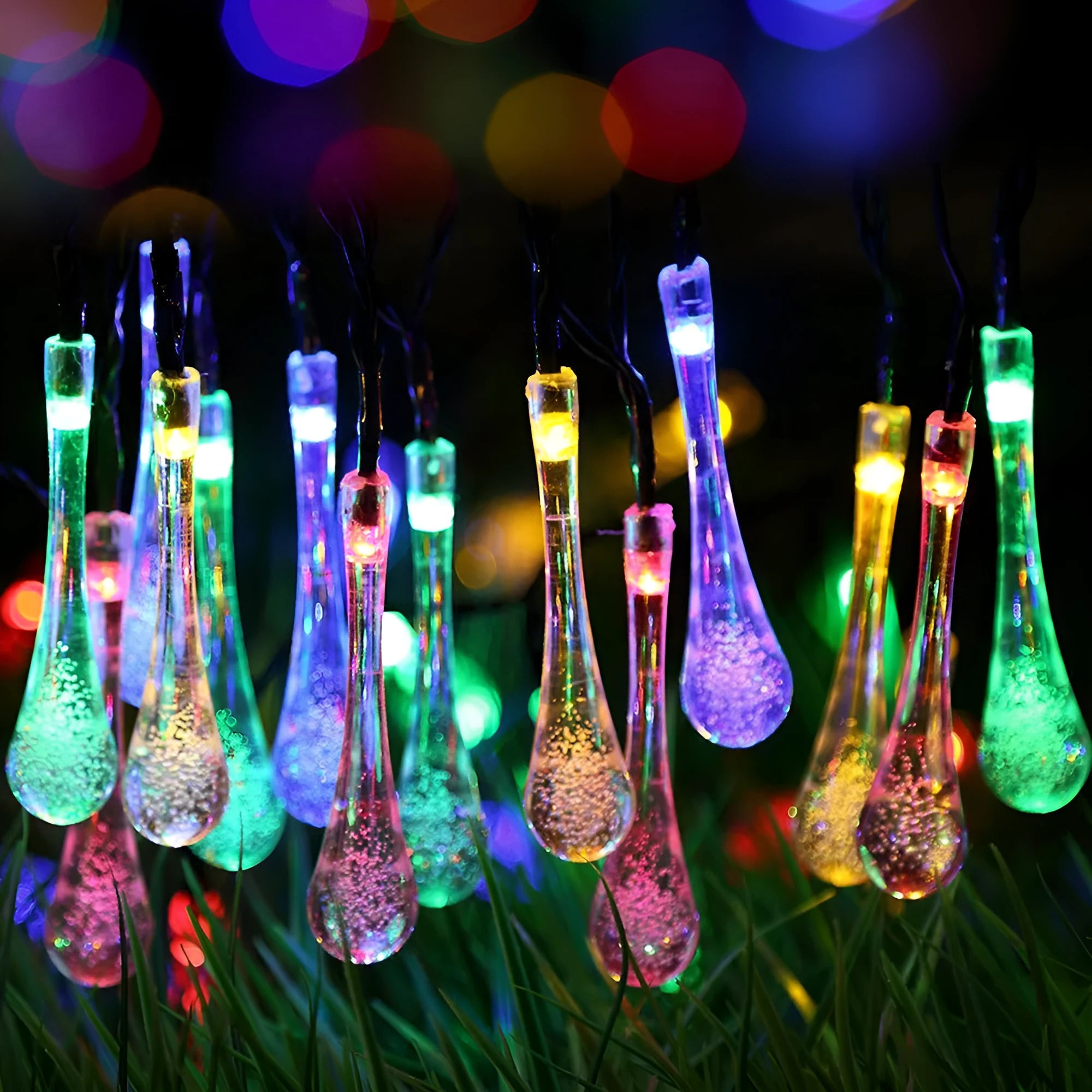 6.5 metre long solar-powered outdoor LED string lights with bubble drop pendants on a garden fence