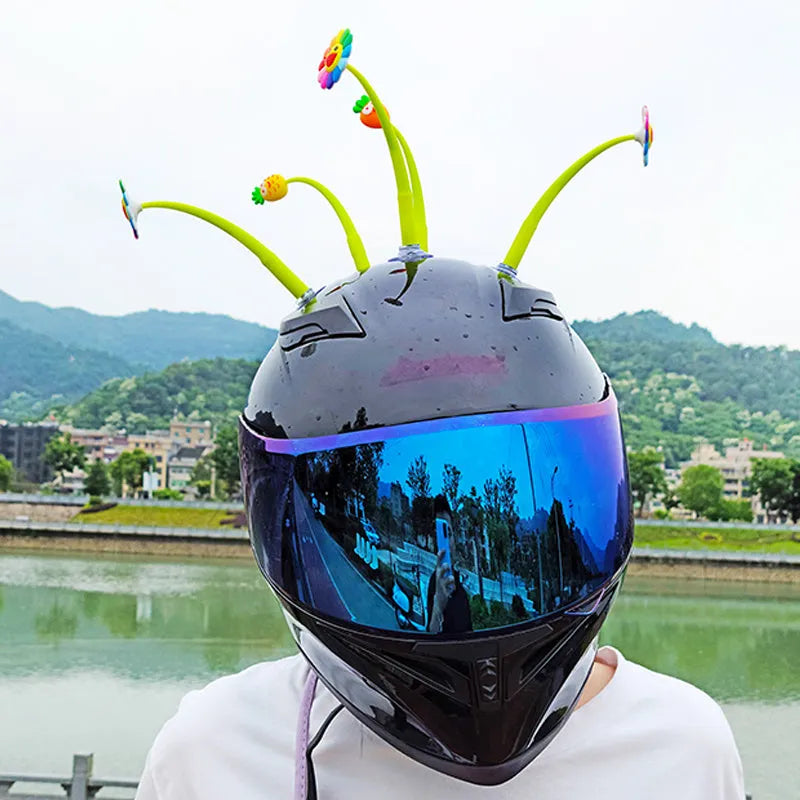 Silicone sunflower helmet decoration with suction cup base on a motorcycle helmet.