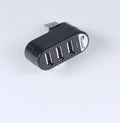 Black and white USB hub with spinning colour indicator showing USB 2.0 multi-interface expansion ports