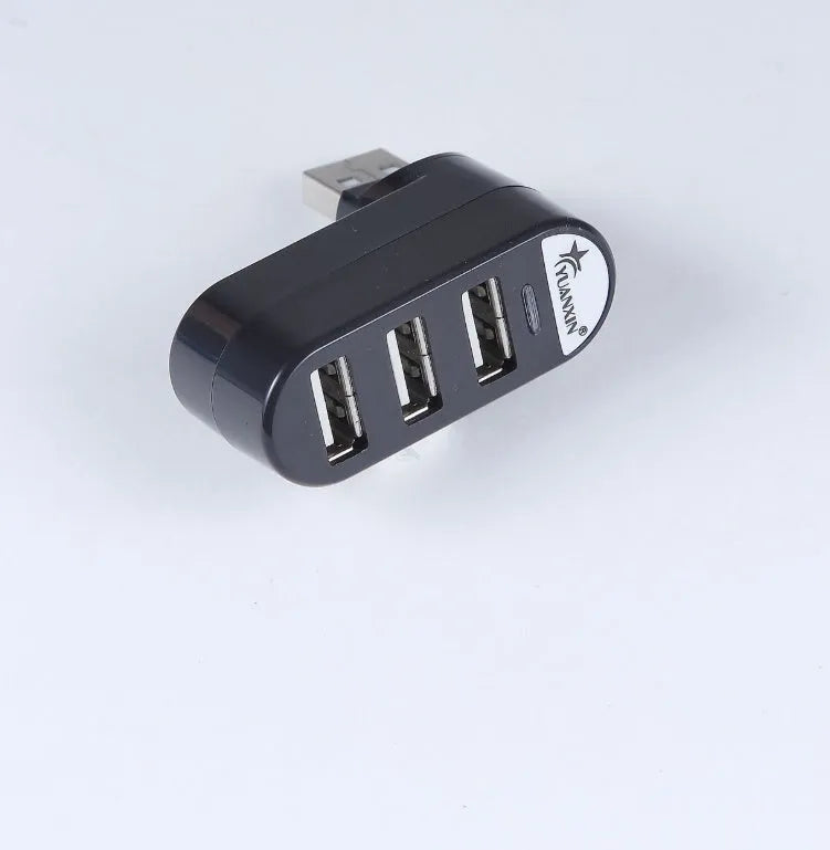 Black and white USB hub with spinning colour indicator showing USB 2.0 multi-interface expansion ports
