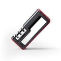 Black and red three-stage professional knife sharpener on a kitchen counter