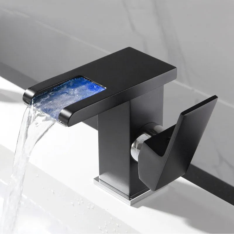 Waterfall basin faucet with chrome finish and induction sensor for hands-free bathroom use