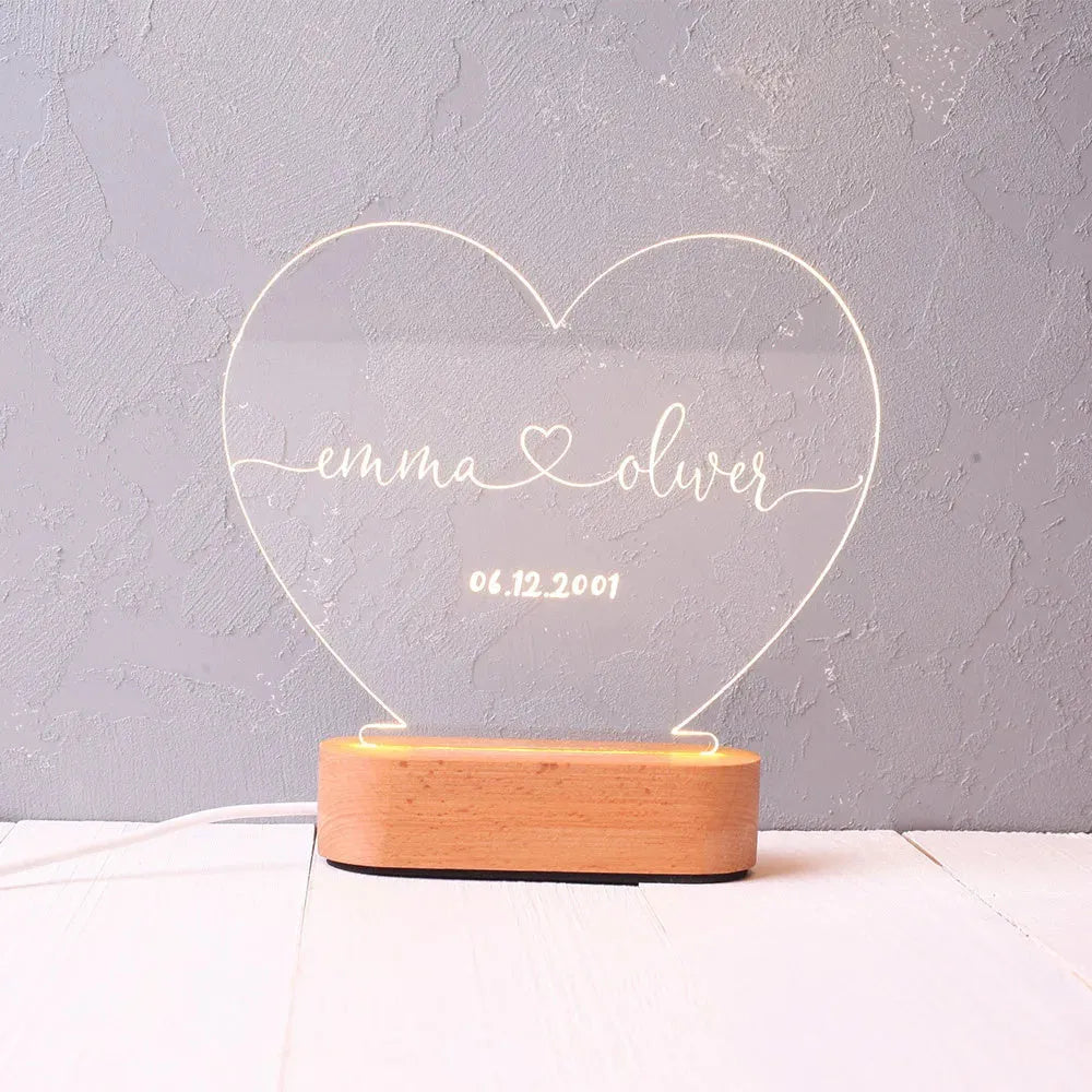 Personalised acrylic night light displaying custom names and date for Valentine's Day gift.