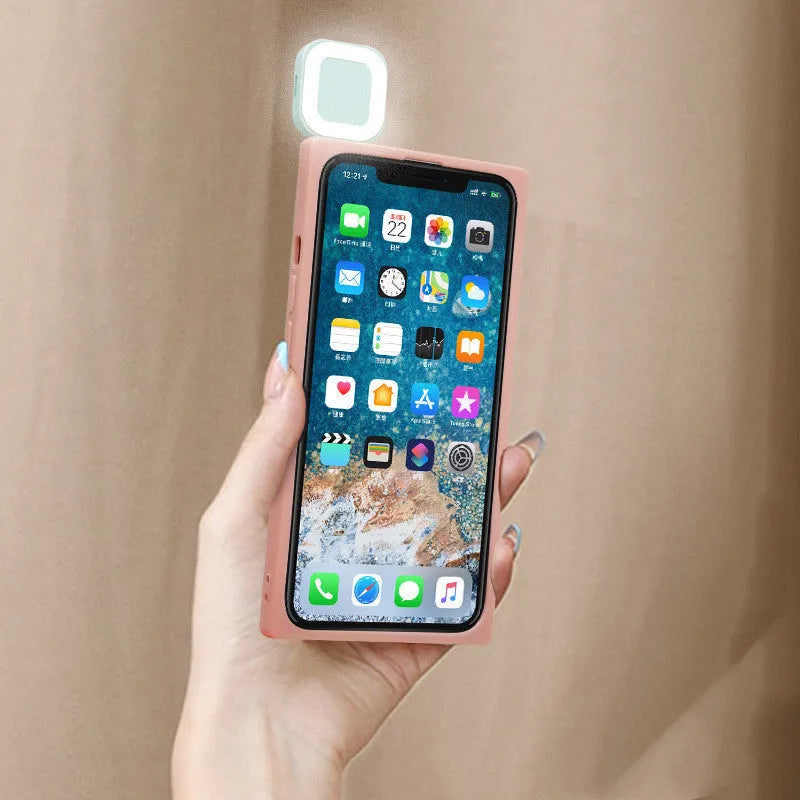 Ring flashing mobile phone case for iPhone 13 with solid colour back cover and integrated selfie light.