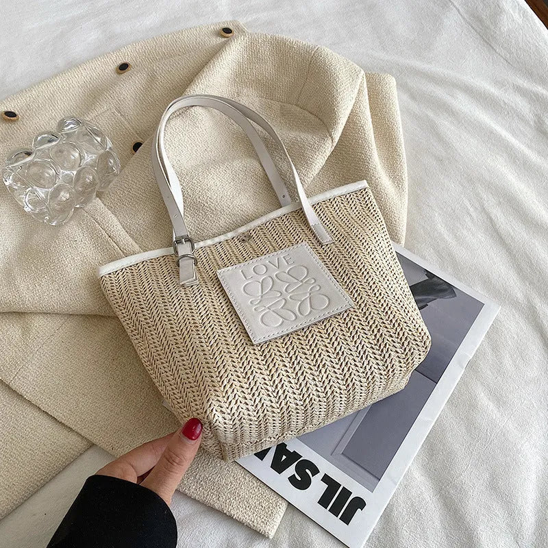 White straw woven women's shoulder bag with three-dimensional pockets showing European retro styling details