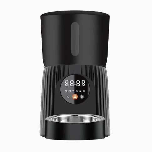 Black automatic pet feeder with smartphone showing feeding schedule and portion control settings