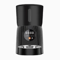 Black automatic pet feeder with smartphone showing feeding schedule and portion control settings