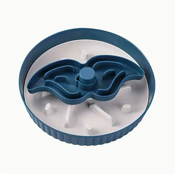 Grey rotating pet bowl with a windmill-pattern silicone licking mat insert for slow feeding.