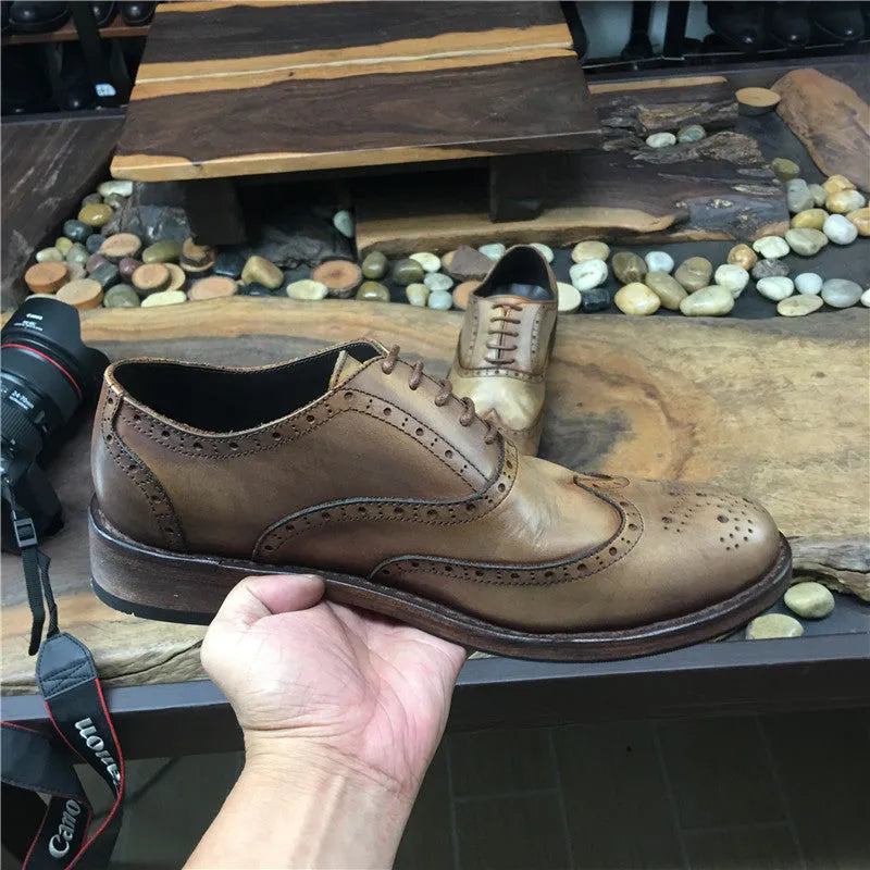 Men's light brown distressed leather lace-up shoes with hand-carved vintage detailing