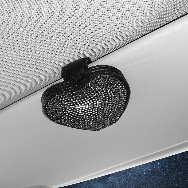 Black PU leather car sun visor clip with diamond accents holding sunglasses and a ticket.