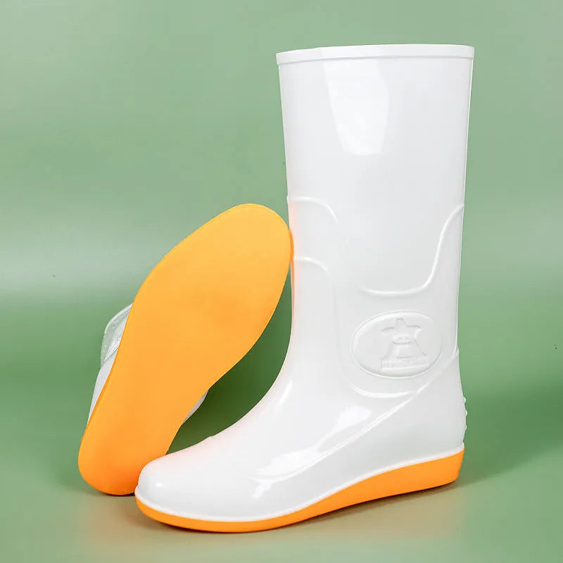Plastic high tube rain boots in white colour with flat heel and round toe design