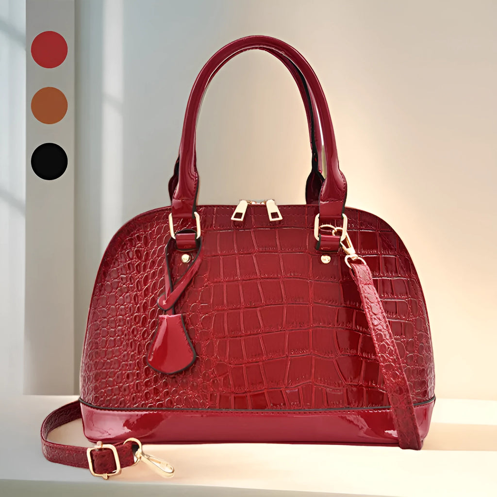 Shiny PU leather shell-shaped crossbody bag in black with dimensions 22x30x15cm