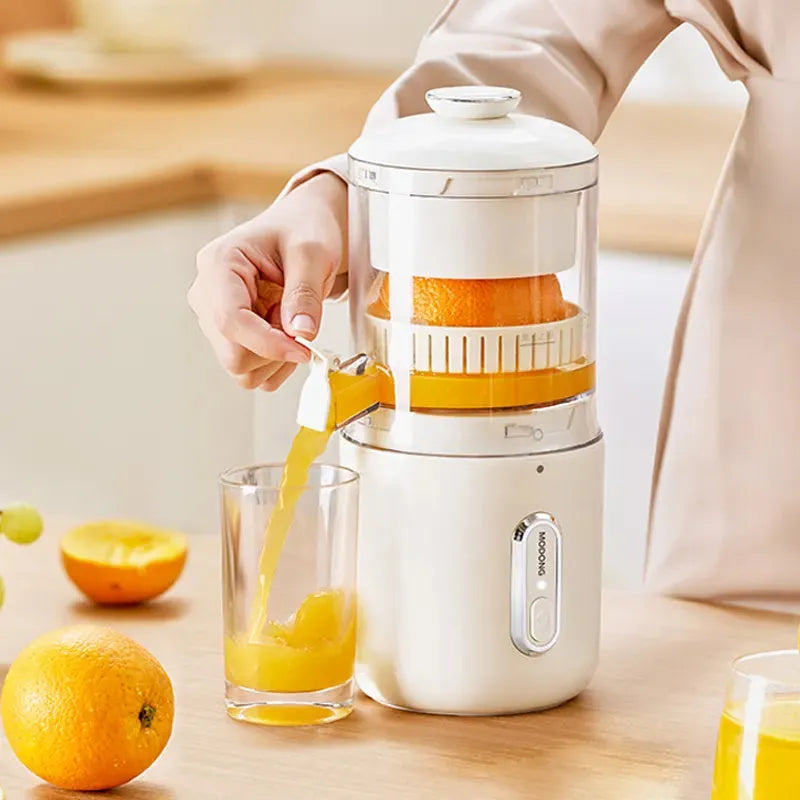 Fresh green wireless portable electric juicer with USB charging cable on a kitchen counter.