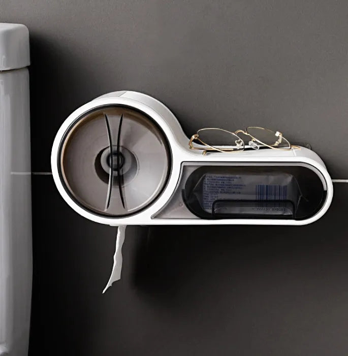 White plastic bathroom roll holder with a streamline curve design on a bathroom surface.