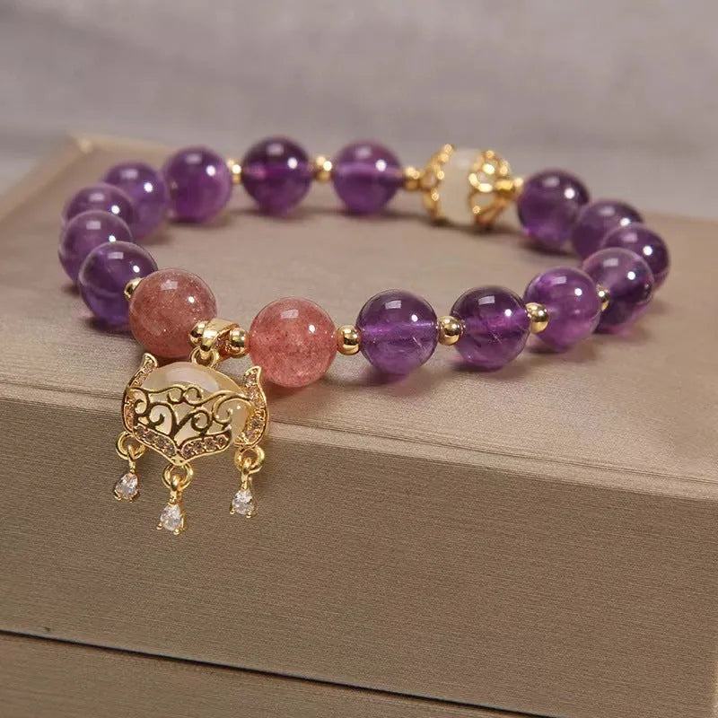 Handmade women's copper bracelet with natural amethyst stone and real gold longevity lock centrepiece