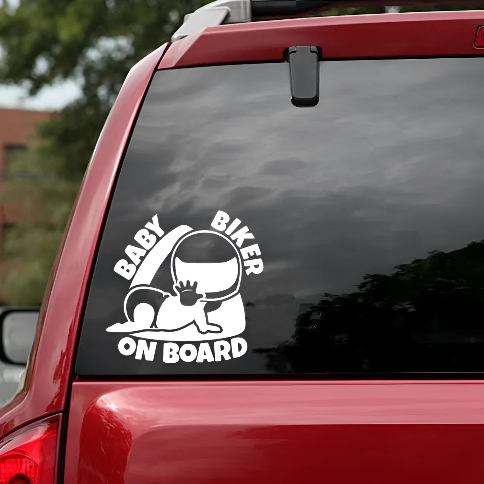 Black and white BABY ON BOARD reflective car sticker measuring 14.5 by 15 centimetres