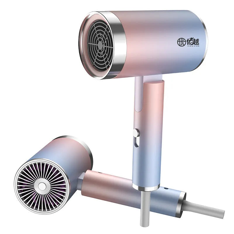 Foldable negative ion hair dryer in emerald green with nozzle attached