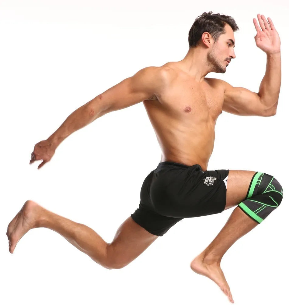 A pair of black non-slip knee pads for sports and fitness activities on a plain background.