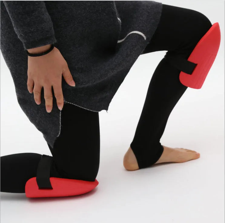 A pair of black EVA foam knee pads for gardening, showing their size and simple design.