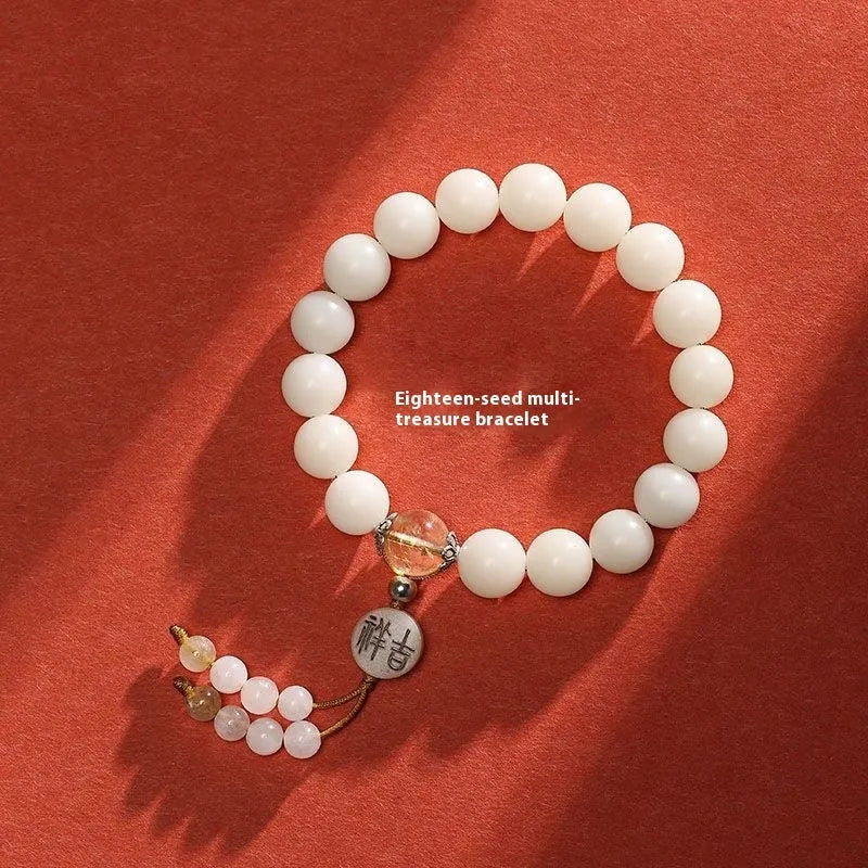 White jade Bodhi bracelet with round 10mm beads, ruyi decoration, shown in obsidian, red agate and red code brain colour variants