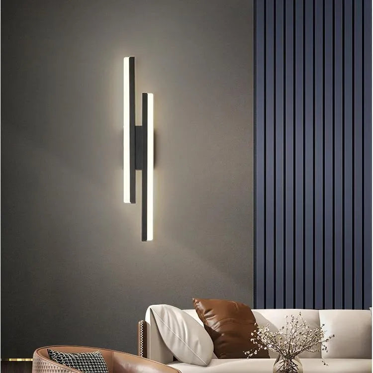 Minimalist Scandinavian-style acrylic LED wall lamp in black or gold, shown in left and right-handed orientations.