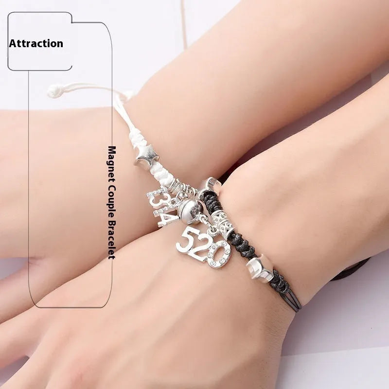 A pair of magnetic couple bracelets with alloy charms showing an I love you design and a key lock on a textured background.
