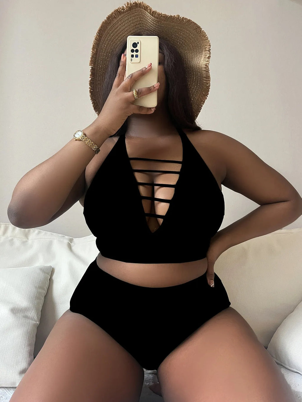 Plus size woman in a solid colour halter neck bikini with adjustable cross-back straps and high-waisted briefs.