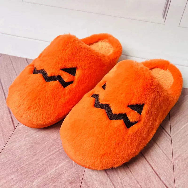 Orange plush Halloween pumpkin slippers with a coral velvet upper and non-slip sole