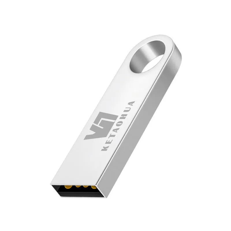 Silver metal car-shaped USB flash drive on a white background, showing its compact size and USB connector.