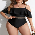 Black solid colour women's one-piece swimsuit on a hanger, polyester fabric, for swimming.