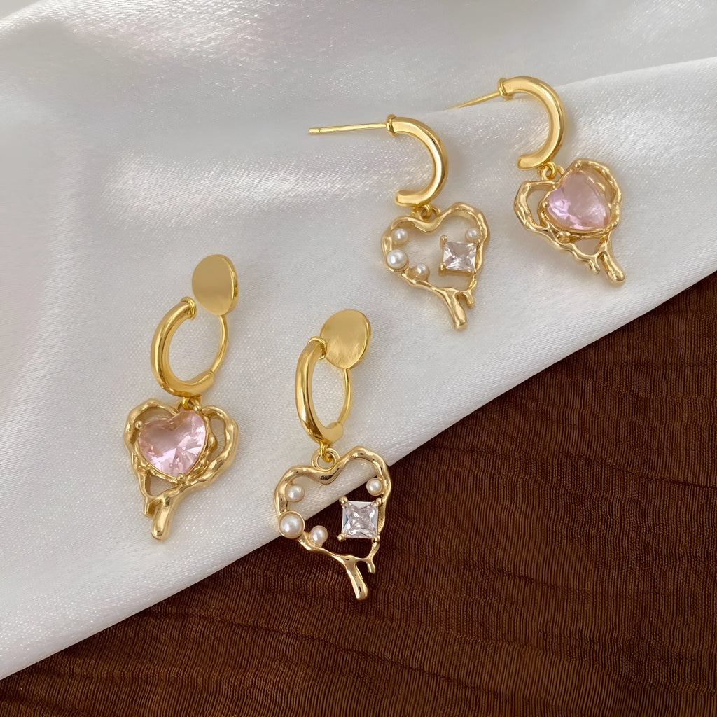 Asymmetric zircon and pearl earrings on copper heart base, light luxury style for women, available as ear clips or ear studs