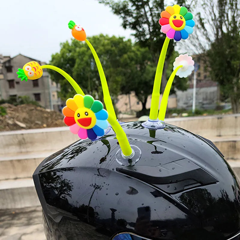 Silicone sunflower helmet decoration with suction cup base on a motorcycle helmet.