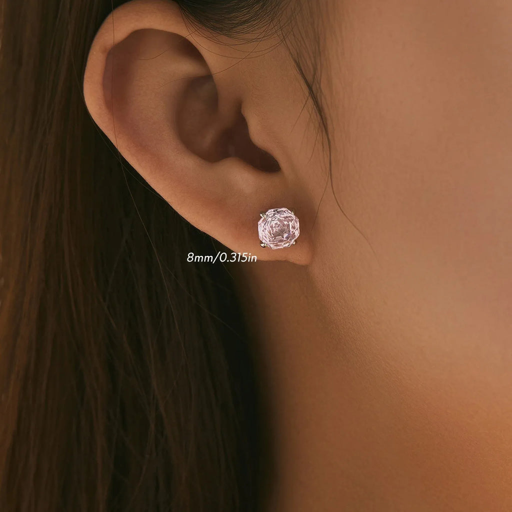 S925 sterling silver rose stud earrings for women in 6mm and 8mm sizes on a pink background.