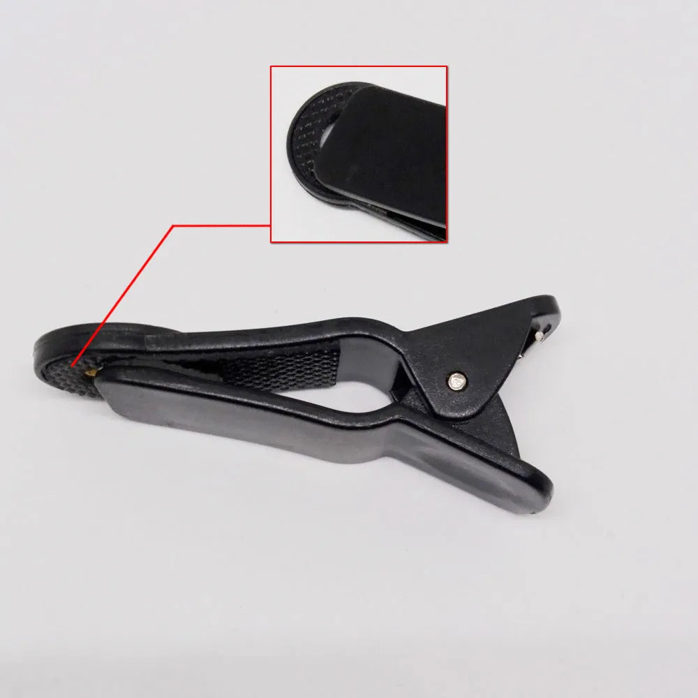 12x telescopic zoom lens with universal clip attached to a mobile phone for long-distance photography.
