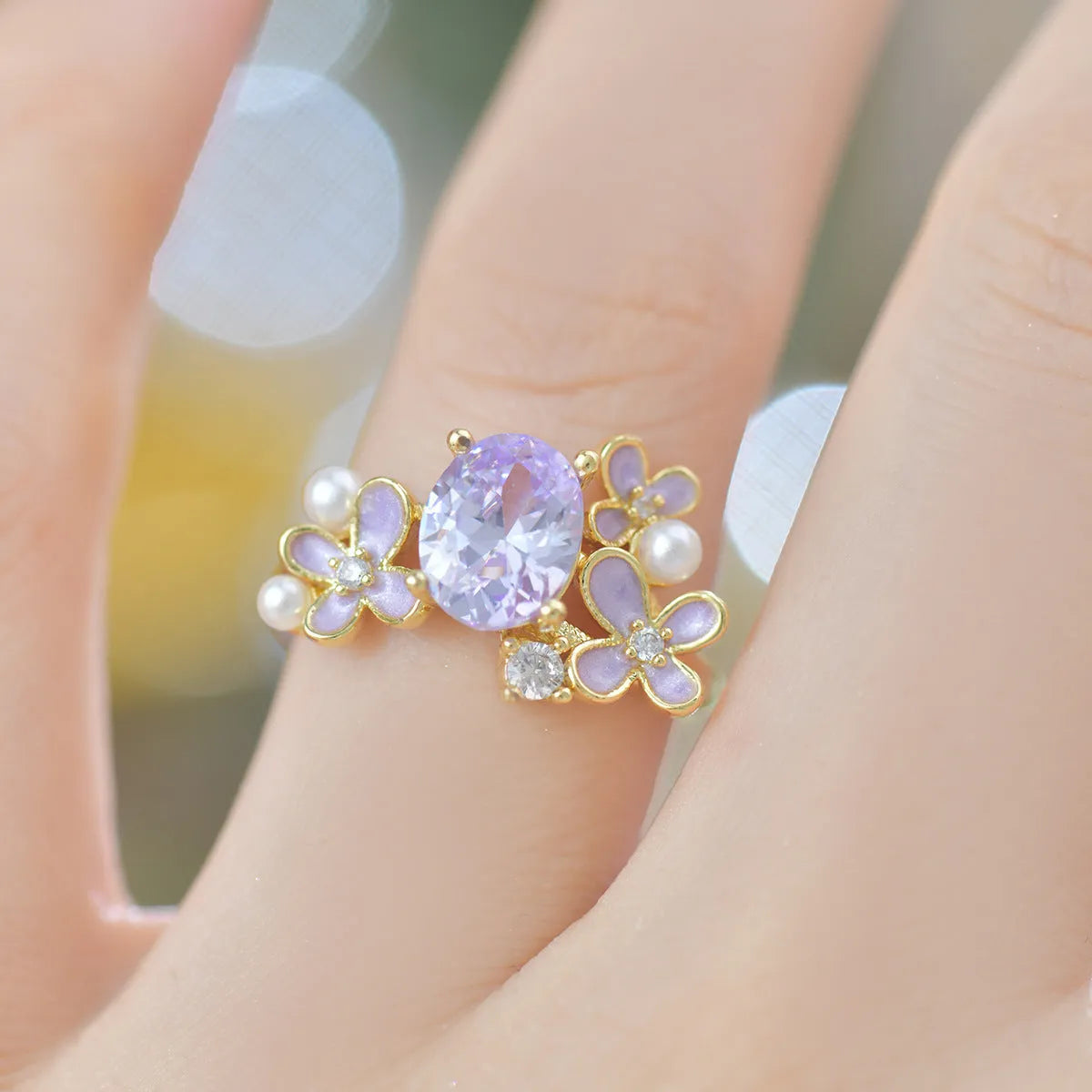 Women's open ring with floral zircon stones in light purple electroplated metal