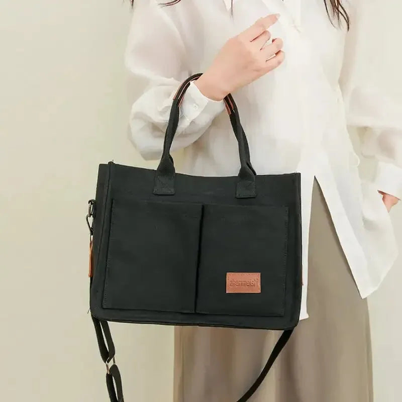 Large casual canvas tote shoulder bag for women with multiple pockets in creamy white