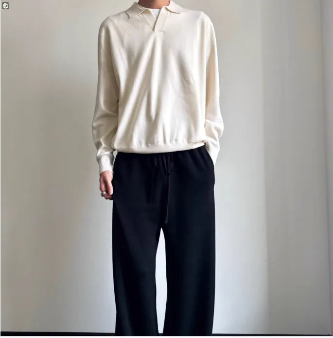 Man wearing a milky white pure wool polo collar sweater with a lapel design.