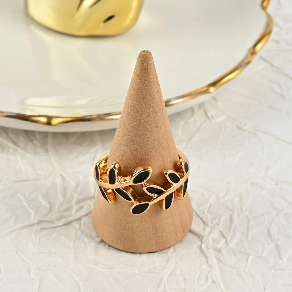 Gold coloured acrylic ring with leaf and flower shape and electroplated finish for women
