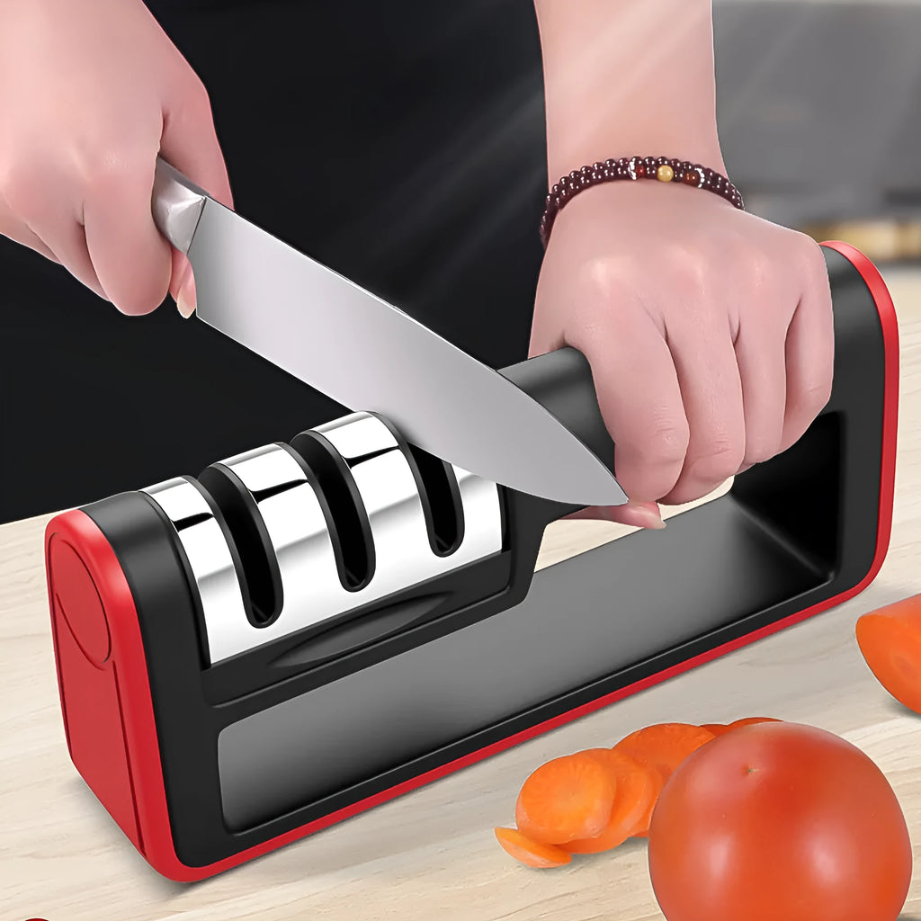 Black and red three-stage professional knife sharpener on a kitchen counter
