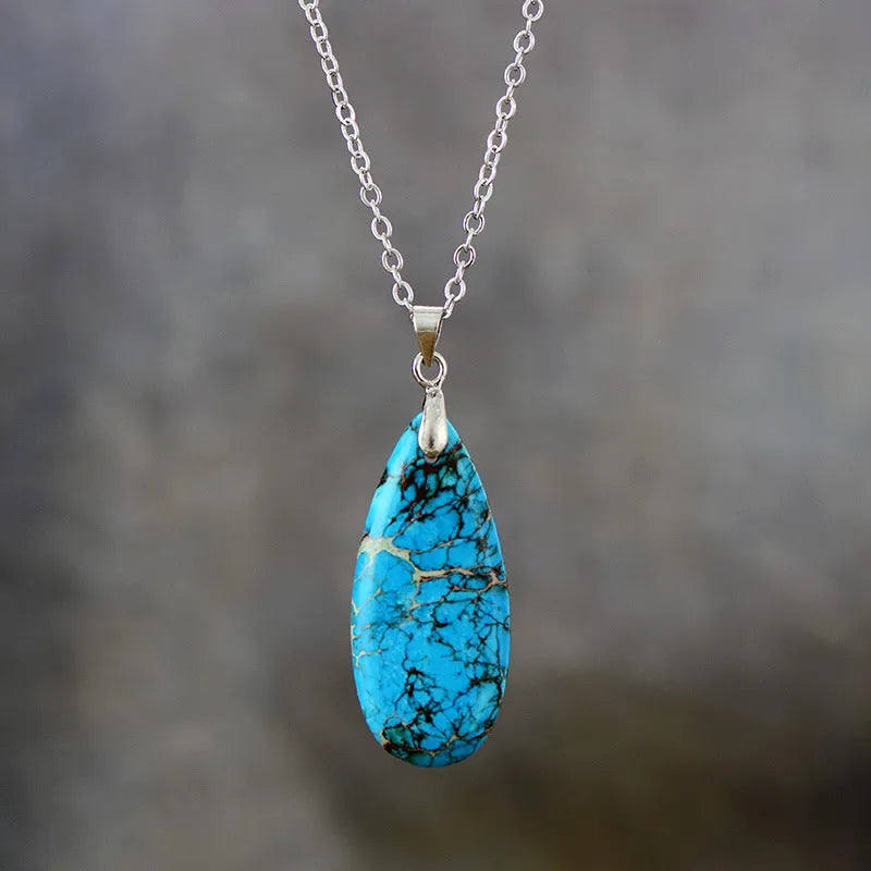 Emperor Stone jade pendant necklace on an 18k gold plated chain with a water drop shape.