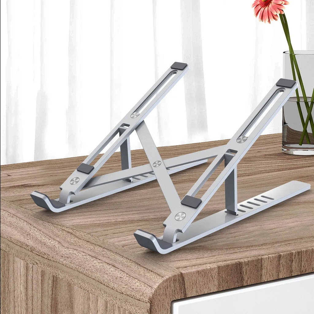 Silver aluminium laptop stand folded to 247x210x65.94mm with six-gear height adjustment mechanism