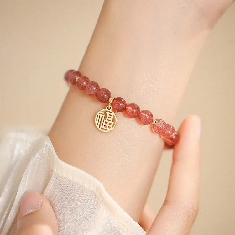 Strawberry quartz glass blessing card bracelet with adjustable clasp on wrist