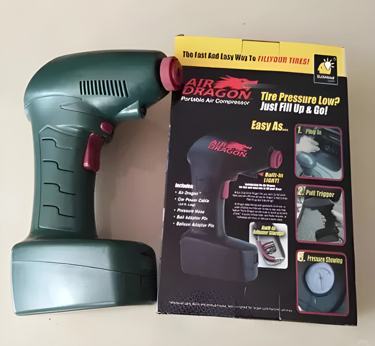 Compact portable car tyre inflator with digital pressure gauge showing 12V DC connection