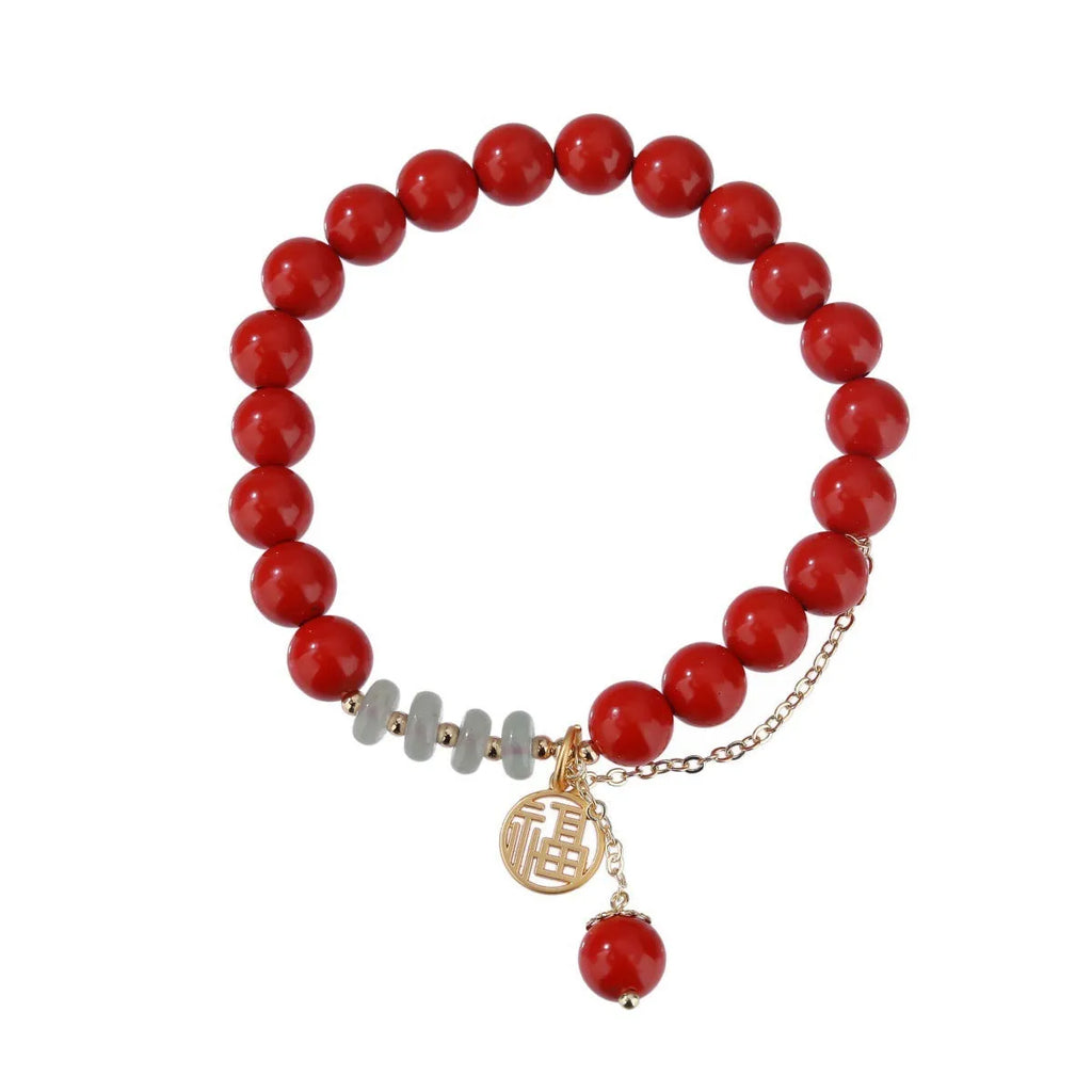Retro red sand cinnabar bracelet with fu character charm, jade ornament, and 8mm tassel