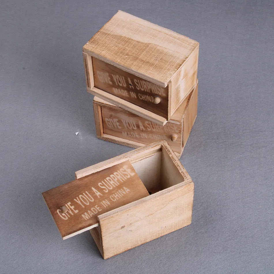 Wooden prank scare box with jumping spider surprise for April Fools jokes