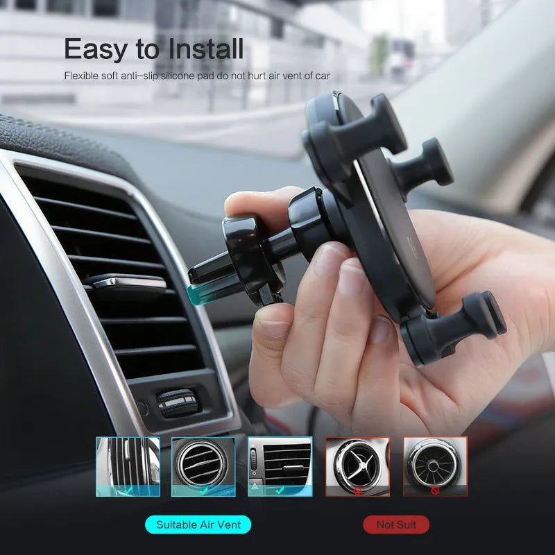 Black car phone holder with gravity bracket mounted on a car dashboard